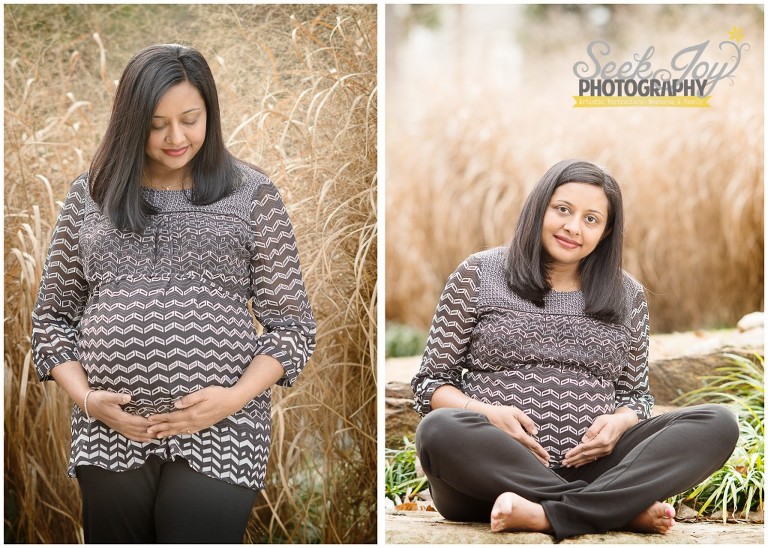 pregnant mother sitting in front of wheat grass 